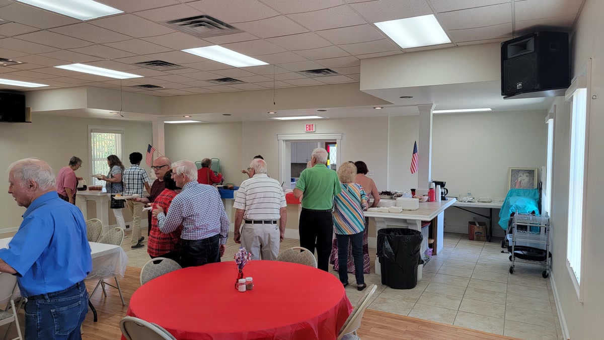 Church members sharing a fellowship meal together at Sugarloaf Church
